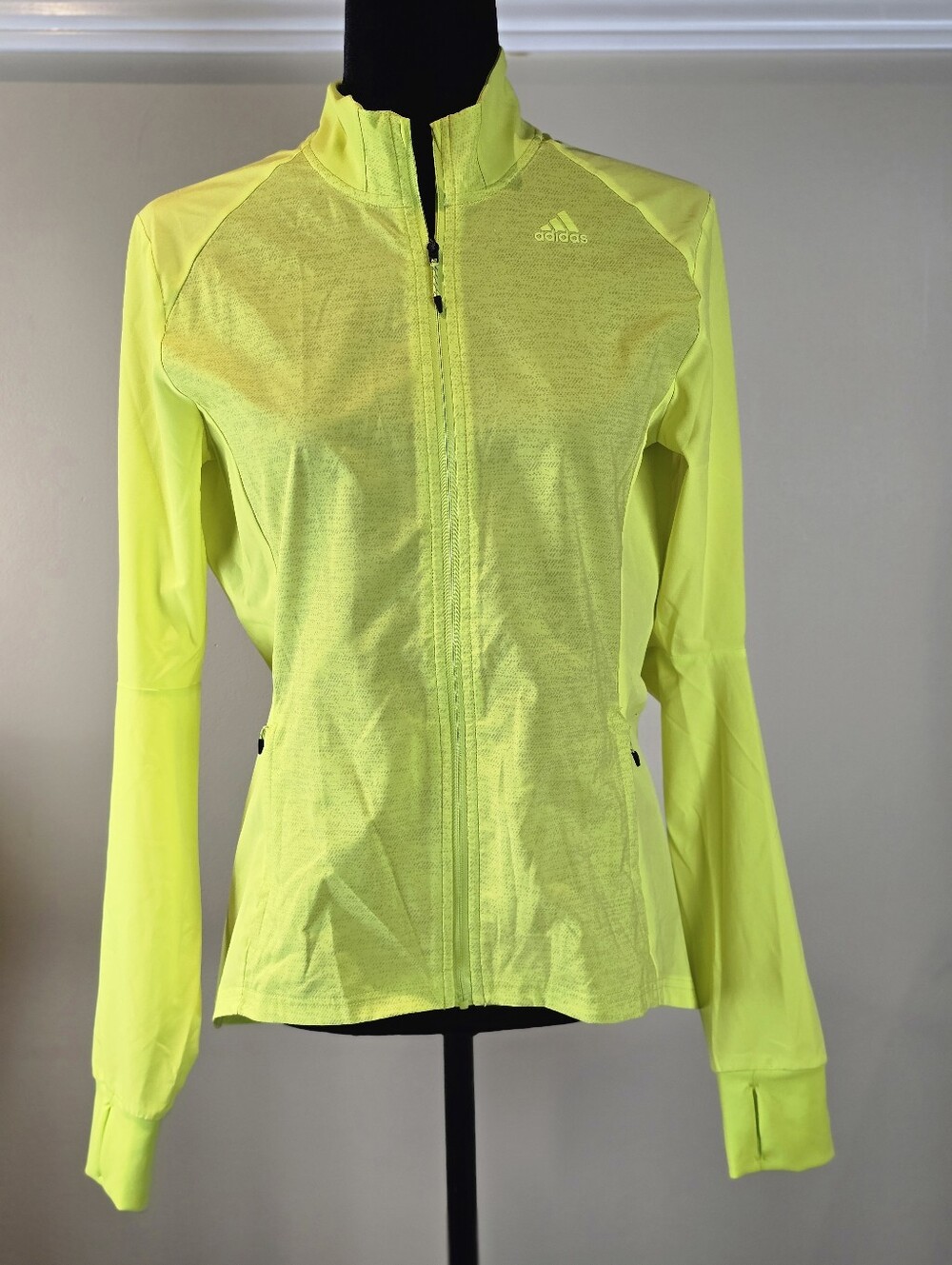 Adidas Supernova Storm Women's Running Jacket in a vibrant, high-visibility fluo